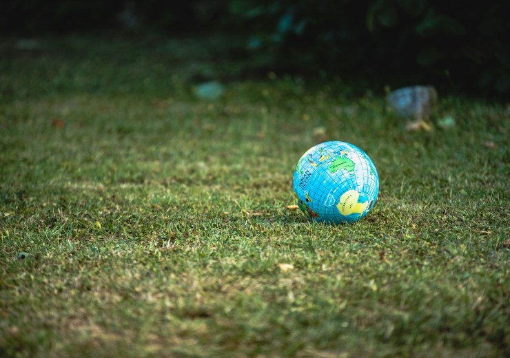 Earth ball on green grass field